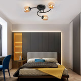 Modern Swirled Metal Flush Mount Light with Elegant Glass Globes for Ambient Bedroom Lighting