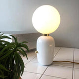 Modern Glass Globe Table Lamp with Polished Metal Frame for Modern Ambient Lighting