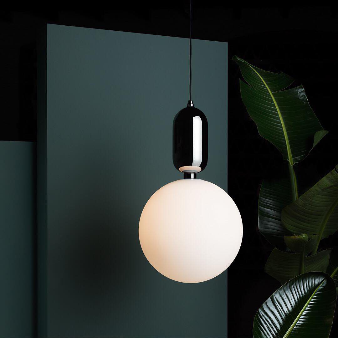 modern-spherical-glass-pendant-light-with-polished-metal-accents-for-luxury-interiors