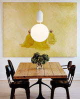 modern-spherical-glass-pendant-light-with-polished-metal-accents-for-luxury-interiors