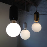 modern-spherical-glass-pendant-light-with-polished-metal-accents-for-luxury-interiors