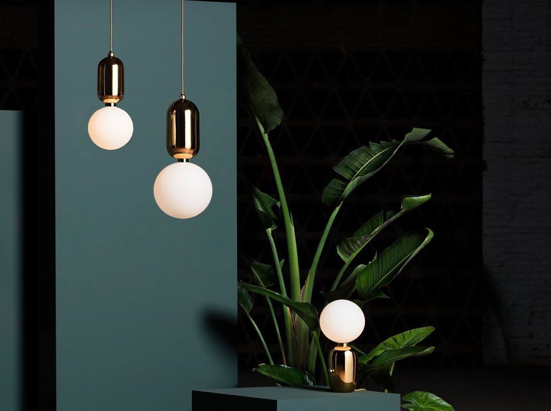 modern-spherical-glass-pendant-light-with-polished-metal-accents-for-luxury-interiors