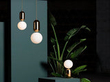 modern-spherical-glass-pendant-light-with-polished-metal-accents-for-luxury-interiors