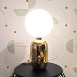 Modern Glass Globe Table Lamp with Polished Metal Frame for Modern Ambient Lighting