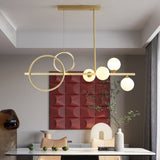 modern-brass-led-linear-chandelier-with-white-glass-spheres-for-restaurant-and-dining-room