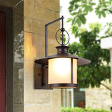 classic-brown-iron-outdoor-wall-lantern-sconce-with-white-glass-shade-for-entryway