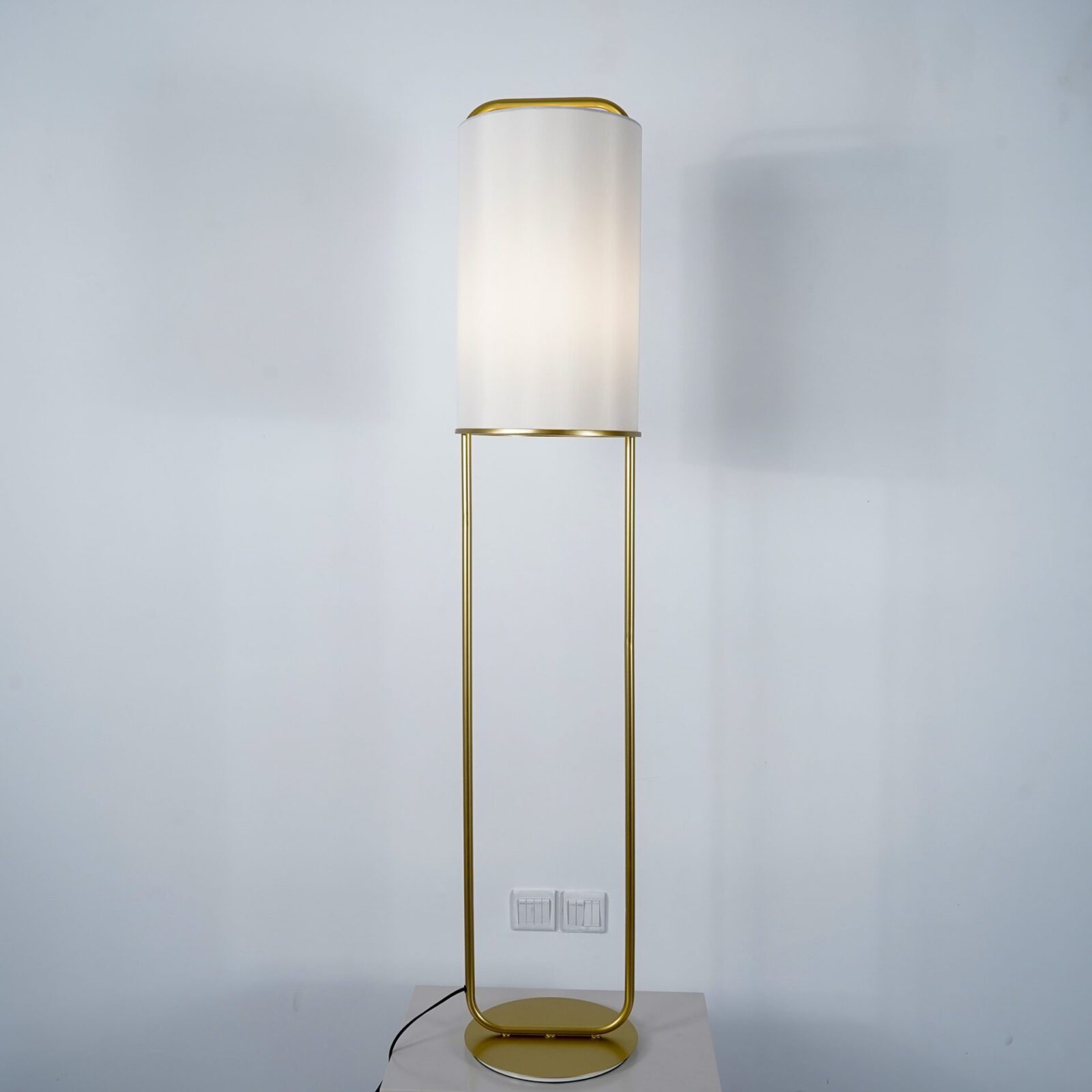 modern-minimalist-geometric-floor-lamp-with-white-fabric-shade-and-gold-metal-base-standing-light