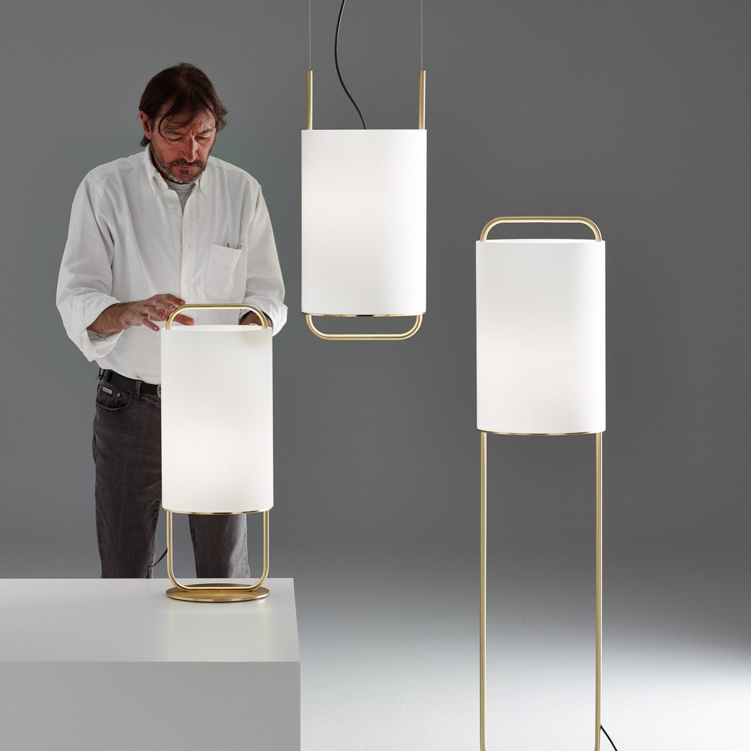modern-geometric-pendant-light-with-white-fabric-cylindrical-shade-and-gold-metal-finish