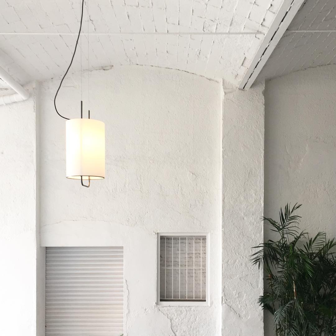 modern-geometric-pendant-light-with-white-fabric-cylindrical-shade-and-gold-metal-finish