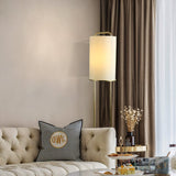 modern-minimalist-geometric-floor-lamp-with-white-fabric-shade-and-gold-metal-base-standing-light