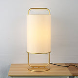 modern-minimalist-geometric-table-lamp-with-white-cloth-shade-and-gold-metal-base-for-elegant-interiors