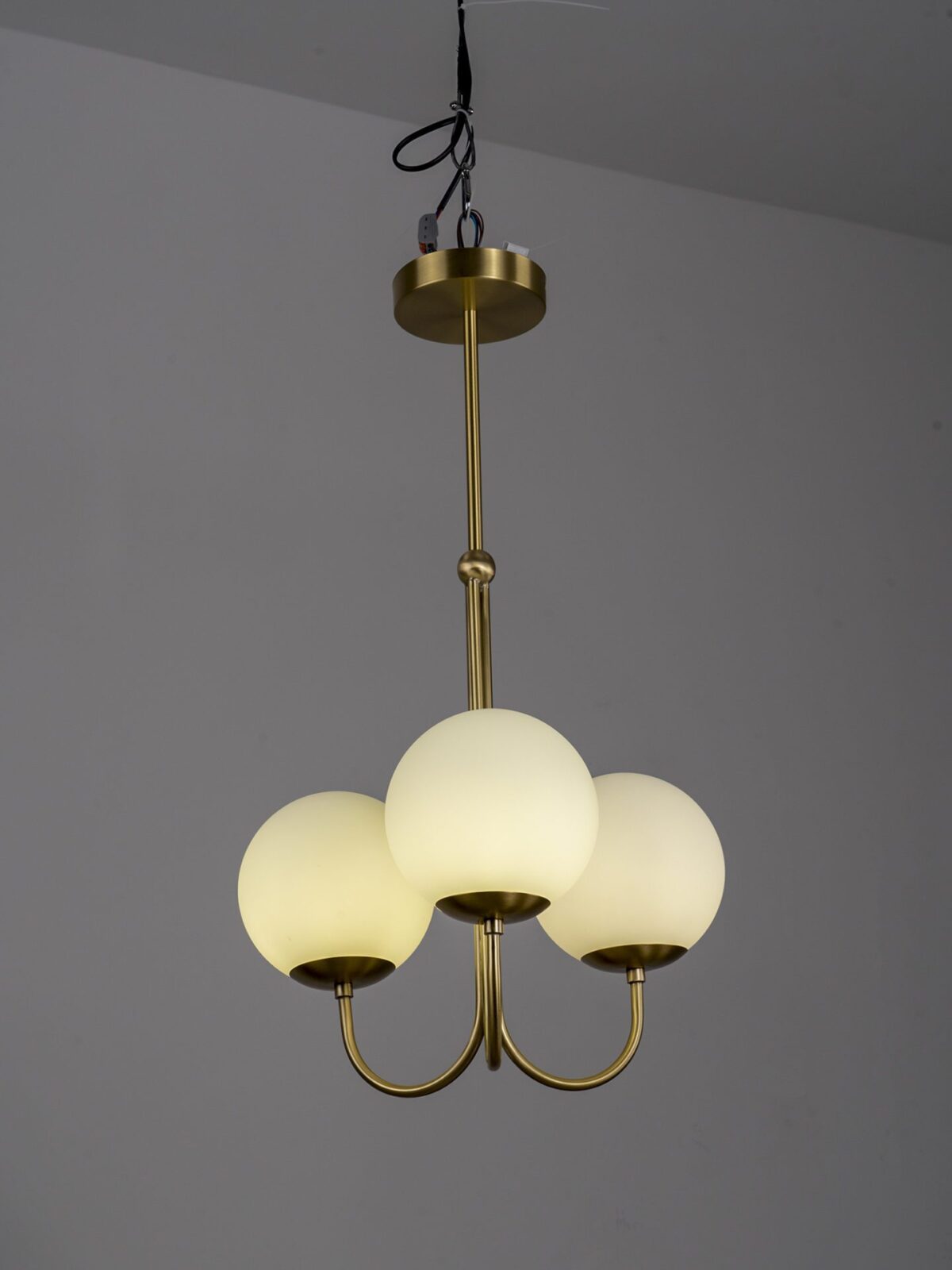 mid-century-modern-triple-angle-brass-pendant-lamp-with-opal-glass-globe-shade