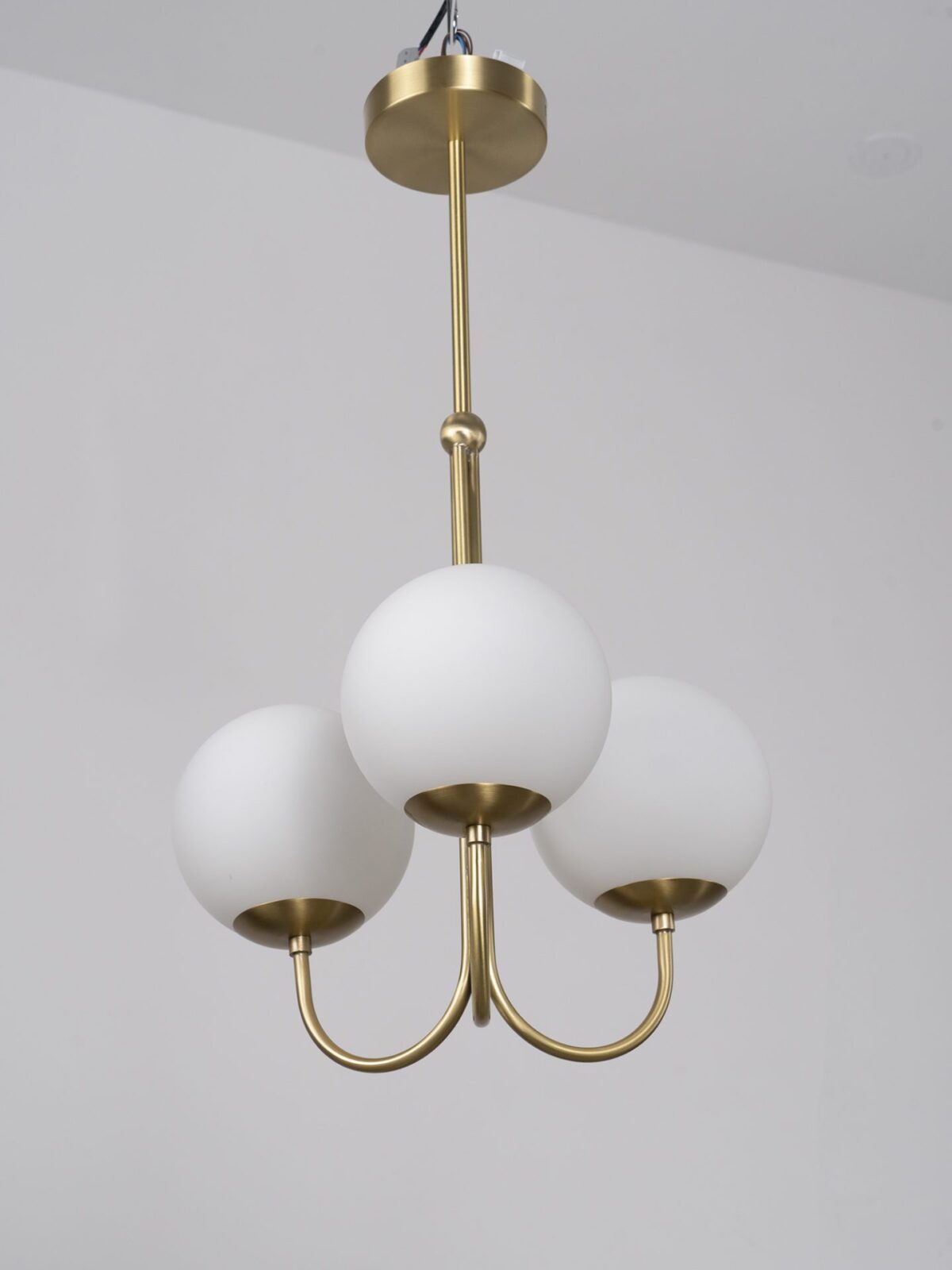 mid-century-modern-triple-angle-brass-pendant-lamp-with-opal-glass-globe-shade