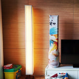 elegant-minimalist-fabric-cylinder-standing-lamp-with-natural-wood-base