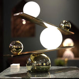 Modern Artistic Balance Table Lamp with Glass Spheres and Black Marble Base