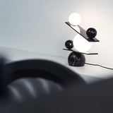 Modern Artistic Balance Table Lamp with Glass Spheres and Black Marble Base