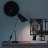 modern-birdy-table-lamp-with-adjustable-arm-and-minimalist-steel-design