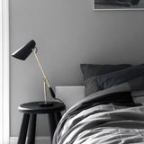modern-birdy-table-lamp-with-adjustable-arm-and-minimalist-steel-design