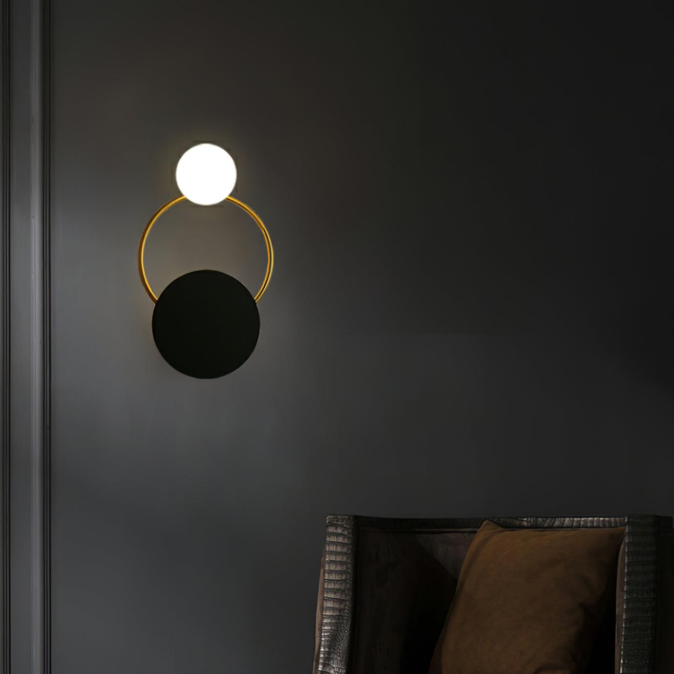modern-geometric-black-and-gold-wall-sconce-with-white-glass-sphere-light-fixture