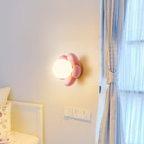 elegant-floral-wall-sconce-lighting-with-glass-shade-and-natural-wood-base