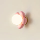 elegant-floral-wall-sconce-lighting-with-glass-shade-and-natural-wood-base