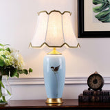 Elegant Blue Ceramic Oval Table Lamp with White Shantung Silk Shade for Modern Interiors