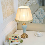elegant-ceramic-and-brass-table-lamp-with-beige-fabric-shade-for-living-room