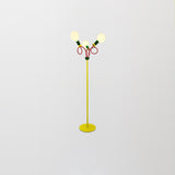 Retro Modern Memphis Style Geometric Floor Lamp with Colorful Accents and Rounded Glass Globe