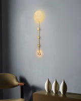 modern-brass-wall-mounted-coat-rack-sconce-with-integrated-led-lighting-for-entryways