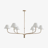 modern-antique-brass-chandelier-with-curved-arms-and-white-tapered-fabric-shades
