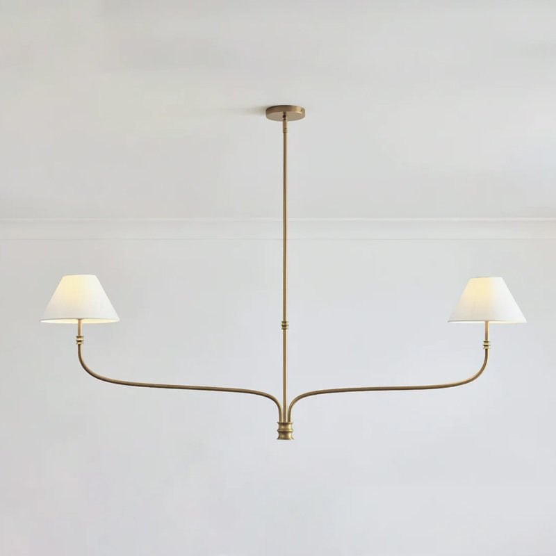 modern-antique-brass-chandelier-with-curved-arms-and-white-tapered-fabric-shades