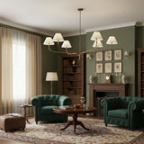 modern-antique-brass-chandelier-with-curved-arms-and-white-tapered-fabric-shades