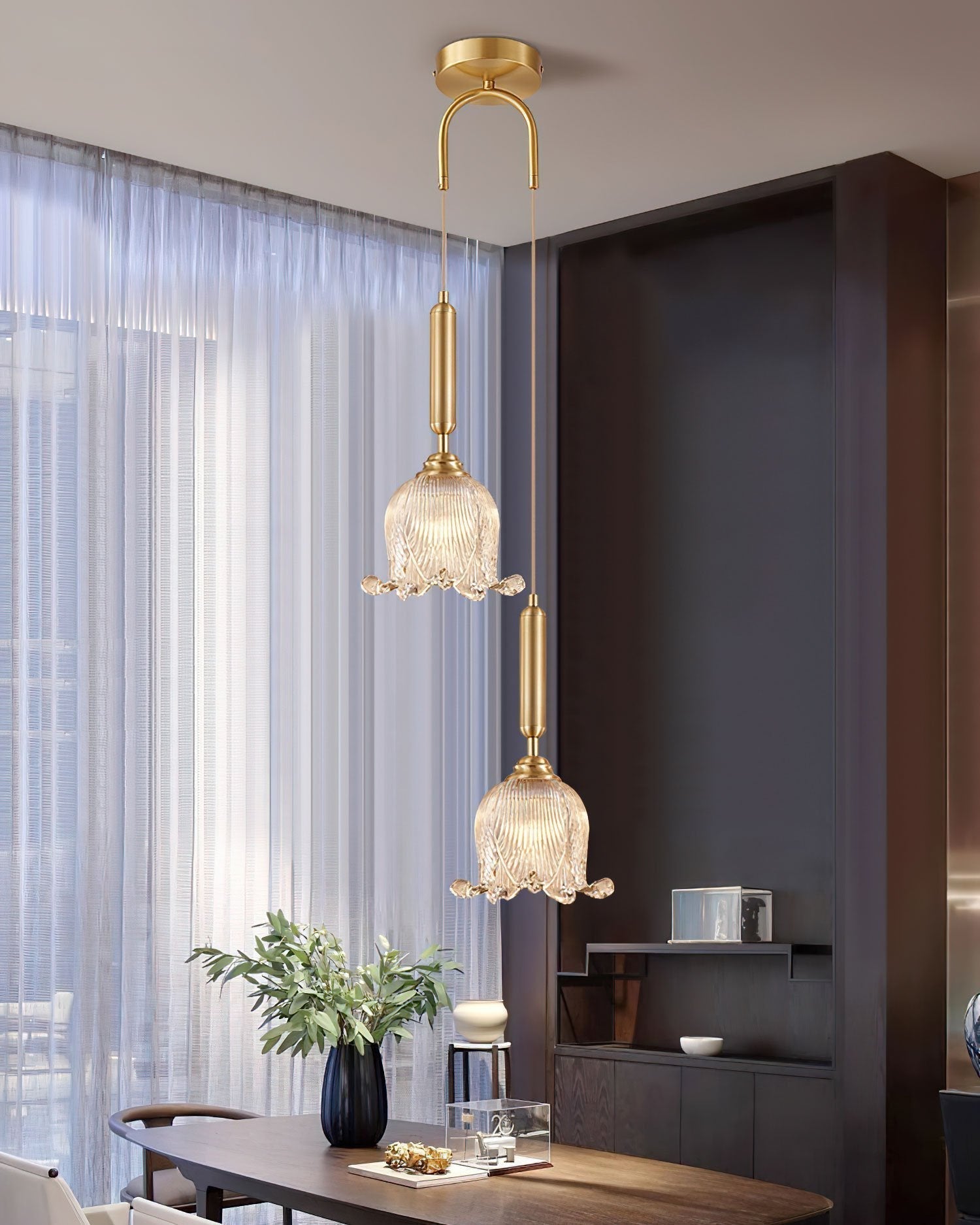 modern-brass-floral-pendant-light-with-clear-crystal-glass-shade-for-dining-areas