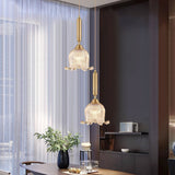 modern-brass-floral-pendant-light-with-clear-crystal-glass-shade-for-dining-areas