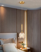 modern-brass-floral-pendant-light-with-clear-crystal-glass-shade-for-dining-areas