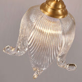 modern-brass-floral-pendant-light-with-clear-crystal-glass-shade-for-dining-areas