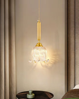 modern-brass-floral-pendant-light-with-clear-crystal-glass-shade-for-dining-areas
