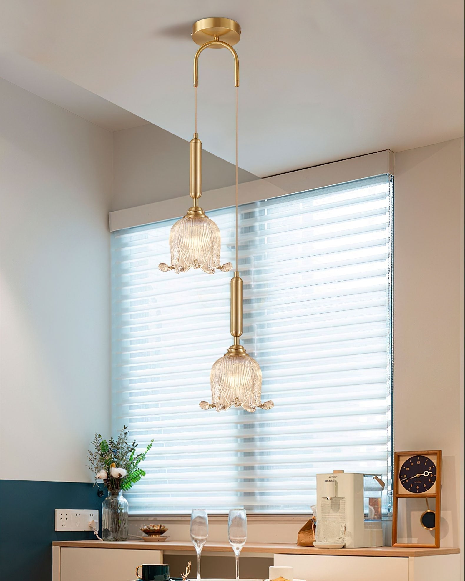 modern-brass-floral-pendant-light-with-clear-crystal-glass-shade-for-dining-areas