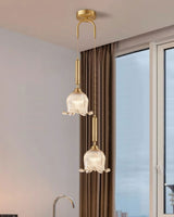 modern-brass-floral-pendant-light-with-clear-crystal-glass-shade-for-dining-areas