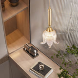 modern-brass-floral-pendant-light-with-clear-crystal-glass-shade-for-dining-areas