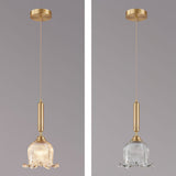 modern-brass-floral-pendant-light-with-clear-crystal-glass-shade-for-dining-areas