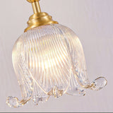 modern-brass-floral-pendant-light-with-clear-crystal-glass-shade-for-dining-areas