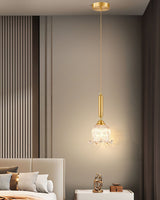 modern-brass-floral-pendant-light-with-clear-crystal-glass-shade-for-dining-areas