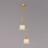 modern-brass-floral-pendant-light-with-clear-crystal-glass-shade-for-dining-areas