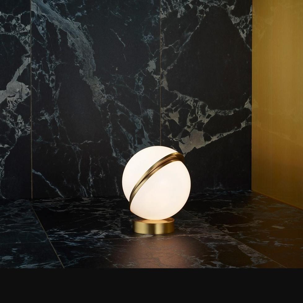 modern-asymmetrical-crescent-table-lamp-with-gold-interior-and-acrylic-globe