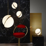 modern-asymmetrical-crescent-table-lamp-with-gold-interior-and-acrylic-globe