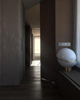 modern-asymmetrical-crescent-table-lamp-with-gold-interior-and-acrylic-globe