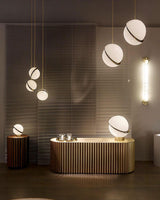 modern-asymmetrical-crescent-table-lamp-with-gold-interior-and-acrylic-globe