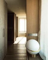 modern-asymmetrical-crescent-table-lamp-with-gold-interior-and-acrylic-globe