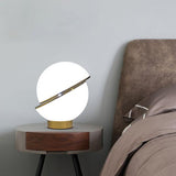 modern-asymmetrical-crescent-table-lamp-with-gold-interior-and-acrylic-globe